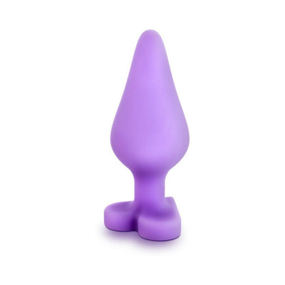 Purple silicone anal plug with heart-shaped base and smooth satin finish for comfortable, safe use.
