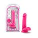 Pink 6-inch dual density dildo with balls and suction cup base shown in and out of packaging.