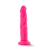Bright pink 7.5 inch dual density dildo with suction cup base standing upright on white background.