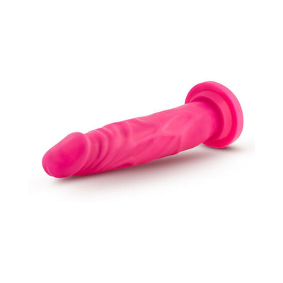 Pink 7.5 inch dual density dildo with suction cup base on white background.