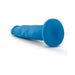 Blue 7.5 inch dual density dildo with suction cup base lying on white background.