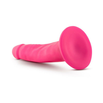 Bright pink 5.5 inch dual density realistic dildo with suction cup base on white background.