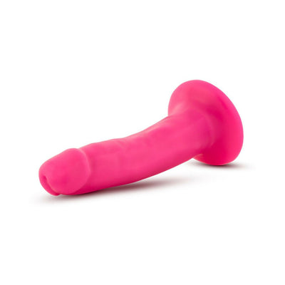 Bright pink 5.5 inch dual density realistic dildo with suction cup base on white background.