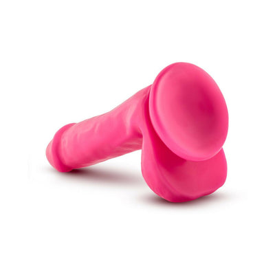 Bright pink silicone dual density dildo with suction cup base and detailed texture, 6 inches long.