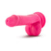 Bright pink silicone dual density dildo with balls and suction cup base on white background