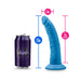 Blue 7.5-inch silicone dual density dildo with suction base shown next to a soda can for size comparison.