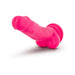 Bright neon pink 7.5-inch silicone dual density dildo with suction cup base and realistic texture.