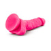 Neon pink 7.5-inch silicone dual density dildo with realistic texture and suction cup base on white background.
