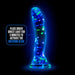 Glow-in-the-dark silicone dildo with colorful confetti inside and suction cup base, illuminated in blue light.