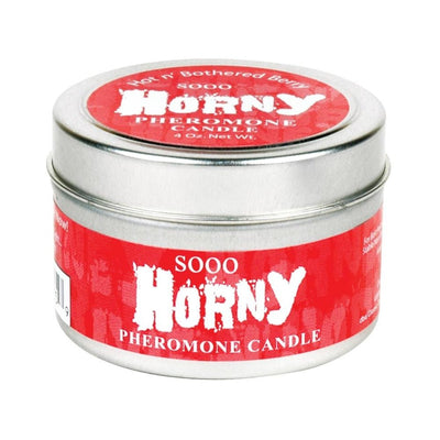 Silver tin container with red label reading "Sooo Horny Pheromone Candle" 4 oz massage candle.
