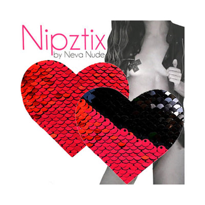 Heart-shaped red to black reversible sequin nipple covers by Neva Nude with a model in the background.