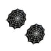 Pair of black spider web design pasties with white detailing on a white background