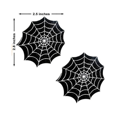 Pair of black spider web shaped pasties with white web detailing, measuring 2.5 by 2.8 inches each.
