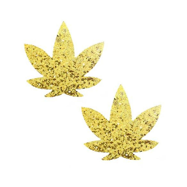 Pair of gold glitter sparkle pasties shaped like stylized leaf motifs on white background