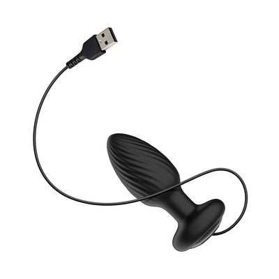 Black silicone vibrating anal plug with textured surface and attached USB charging cable on white background.