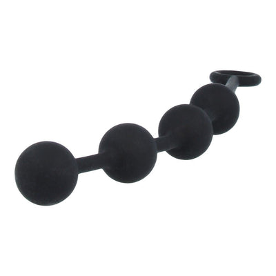 Medium black silicone anal beads with four smooth spheres and a secure removal loop on a white background.