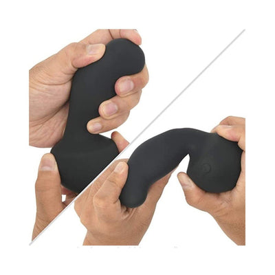 Hands holding and bending the flexible black silicone Nexus Gyro Vibe with ergonomic curved design.