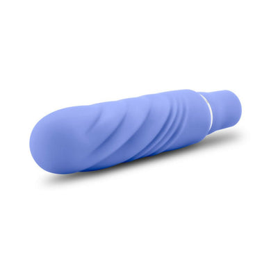 Compact blue silicone mini stimulator with textured swirl design and smooth satin finish.