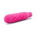 Compact pink silicone mini stimulator with textured swirling design and smooth satin finish on white background.