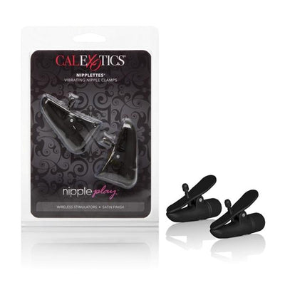 Black vibrating nipple clamps with wireless control and satin finish in clear retail packaging and displayed outside package.