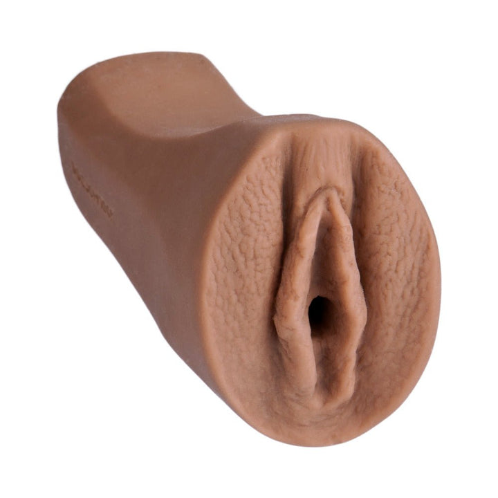 Compact caramel-colored realistic palm-sized masturbator made from soft UR3 material by Noches Latinas.