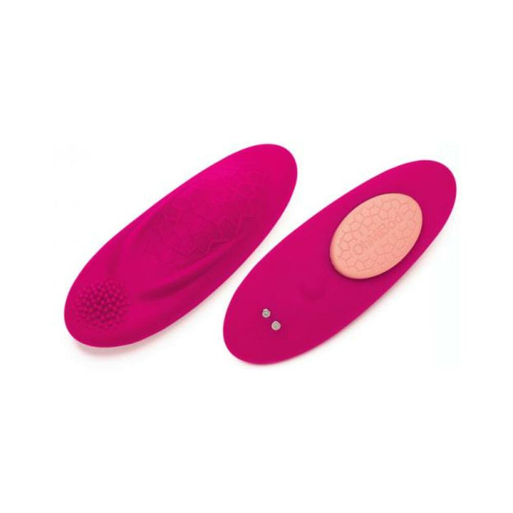 Ohmibod Foxy wearable panty vibrator in pink with textured surface and magnetic charging pad shown from two angles.