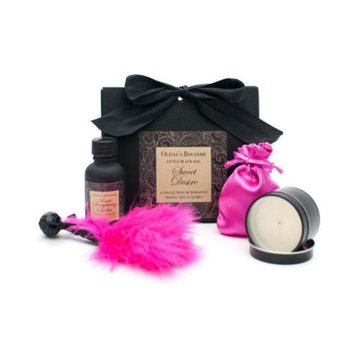 Olivia's Boudoir Sweet Desire Kit with black gift box, pink feather tickler, massage oil, satin pouch, and massage candle.
