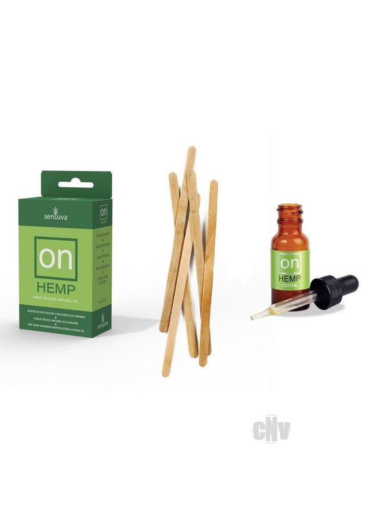 On Hemp arousal oil box with wooden applicator sticks and a small amber dropper bottle labeled tester.