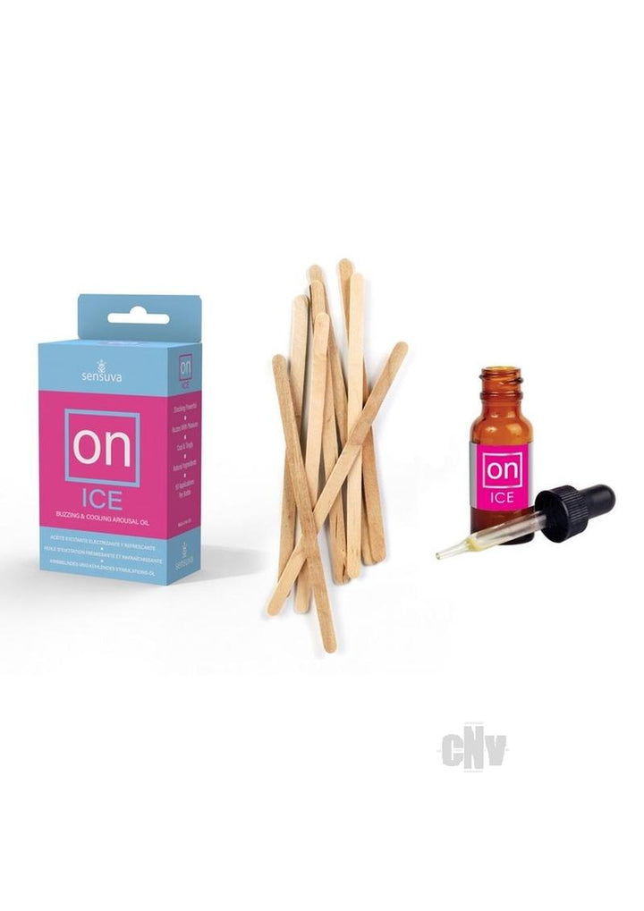 On Ice arousal oil box with amber dropper bottle and wooden applicator sticks on white background