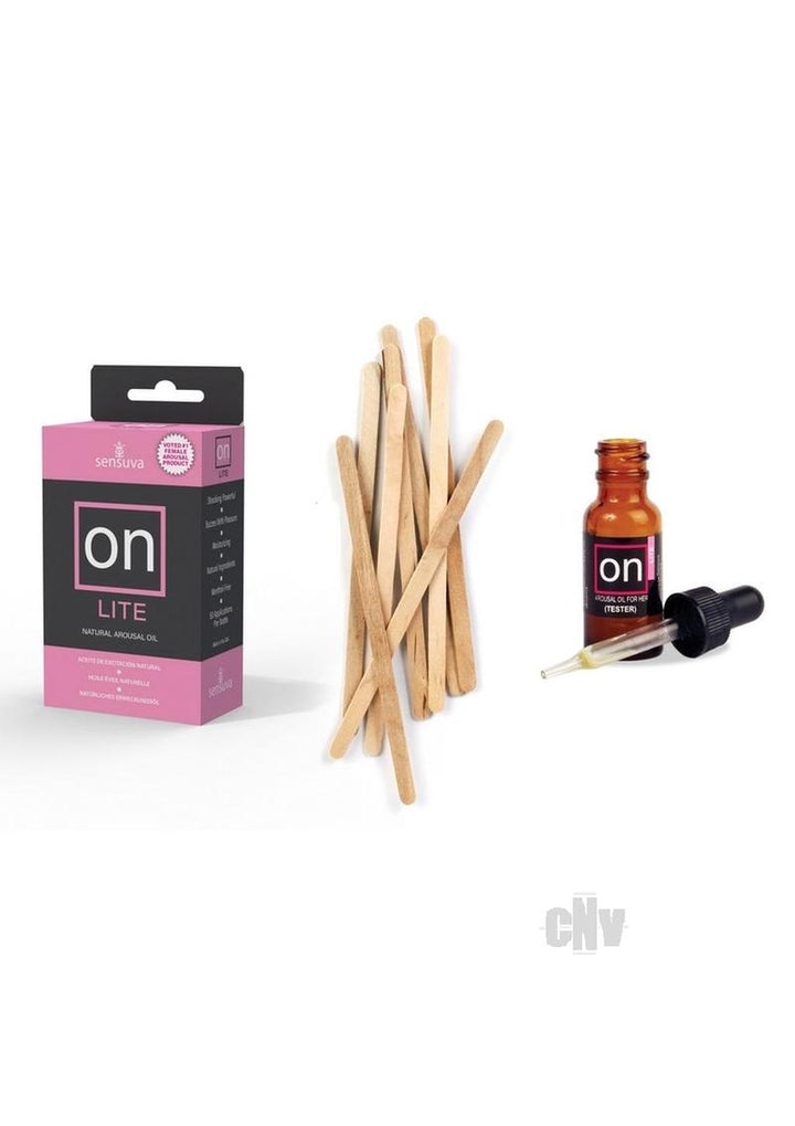 On Lite natural arousal oil box with wooden applicator sticks and a small amber dropper bottle tester on white background.