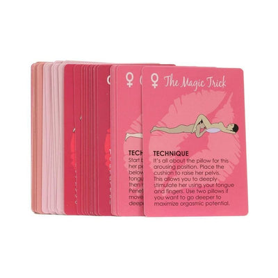 Stack of pink and red oral sex card game cards featuring illustrated techniques and instructions for couples.