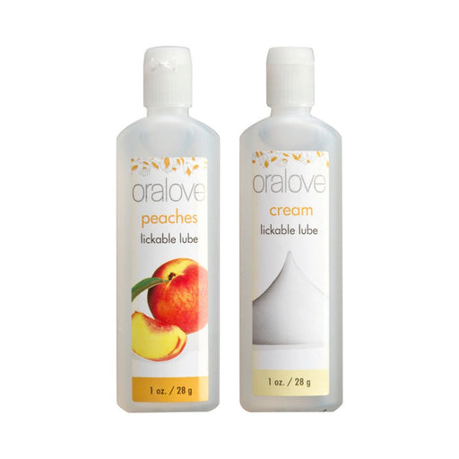 Two 1 oz bottles of Oralove lickable lubricants in peaches and cream flavors with simple white labels.