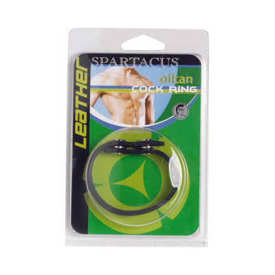 Original Oiltan black leather cock ring in clear retail packaging with green and blue Spartacus branding.