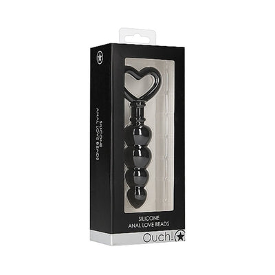 Black silicone anal beads with heart-shaped handle in black and clear retail packaging.