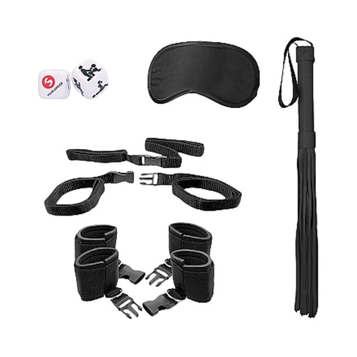 Black bed post bindings restraint kit with wrist and ankle cuffs, blindfold, flogger, and playful dice.