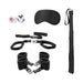 Black bed post bindings restraint kit with wrist and ankle cuffs, blindfold, flogger, and playful dice.