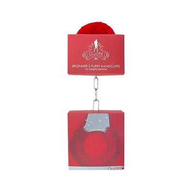 Red beginner's furry handcuffs in packaging with soft faux fur lining and metal chain link detail.