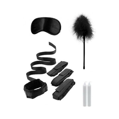 Black bed bindings restraint kit with adjustable cuffs, blindfold, feather tickler, and two white candles.