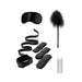 Black bed bindings restraint kit with adjustable cuffs, blindfold, feather tickler, and two white candles.