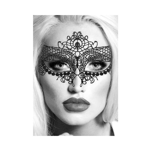 Close-up of a woman wearing an elegant black lace eye mask with intricate Venetian-inspired patterns.