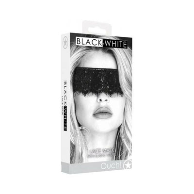 Packaging of Ouch! Black & White lace eye mask with elastic straps shown on a model with blonde hair.