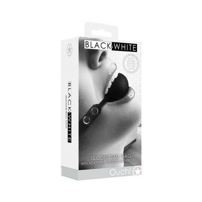 Packaging of Ouch! Black & White silicone ball gag with adjustable bonded leather straps shown on a grayscale close-up of a person wearing the gag.