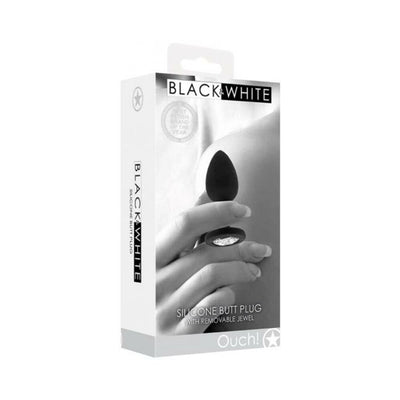 Packaging of Ouch! Black & White silicone butt plug featuring a removable jewel and elegant black and white design.