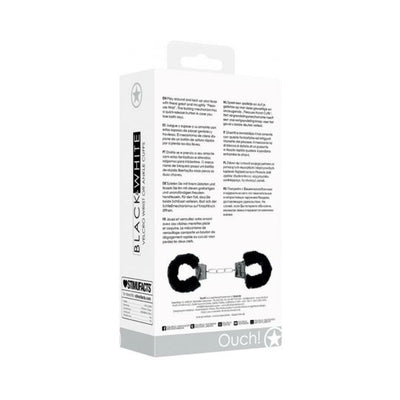 Packaging box of Ouch! Black & White Velcro hand or ankle cuffs with adjustable straps and furry lining shown on back.