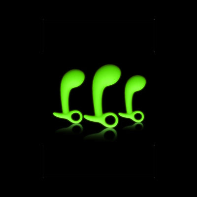 Set of three green glow-in-the-dark prostate massagers in small, medium, and large sizes with ergonomic curved design.