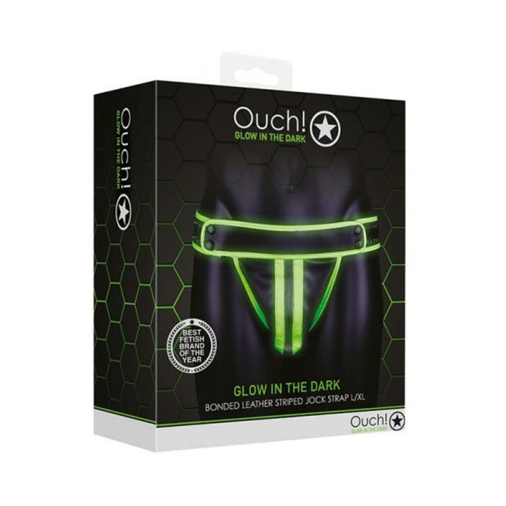Packaging box of Ouch! Glow in the Dark green striped bonded leather jock strap in size L/XL with glow effect illustration.