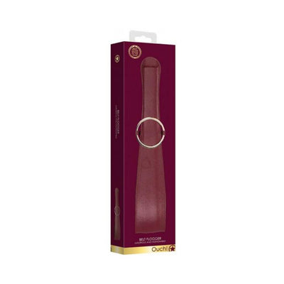 Burgundy leather-look belt flogger with gold ring detail in elegant packaging