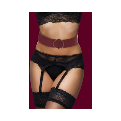 Close-up of a model wearing the Ouch Halo Waist Belt L/XL in burgundy with gold ring detail over black lace lingerie and stockings.