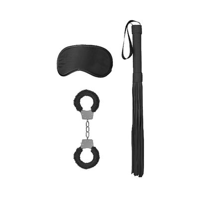 Black satin blindfold, furry-lined metal handcuffs, and a black leather flogger with wrist strap on white background.