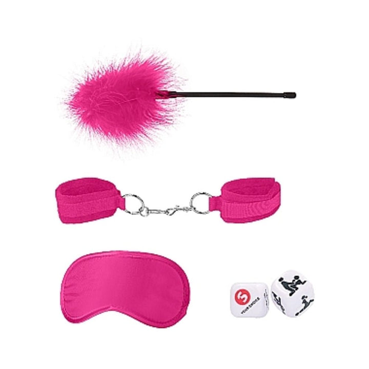 Introductory bondage kit with pink feather tickler, adjustable velvet cuffs, satin blindfold, and two dice on white background.